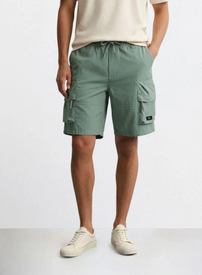 The Indian Garage Co Men Relaxed Fit Solid Cargo Pocket Mid-Rise Cargo Shorts